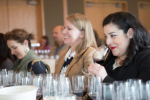 Attendees drink in knowledge and wine in a Taste Washington's seminar.